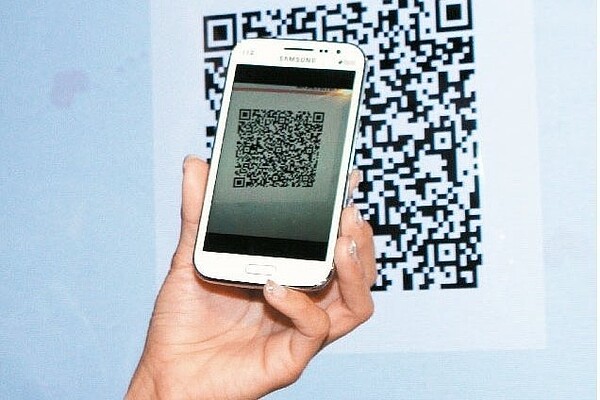 為利國內行動支付更加便捷,財金公司正積極制定國內QR Code支付標準。 聯合報系資料照,記者曾吉松/攝影
