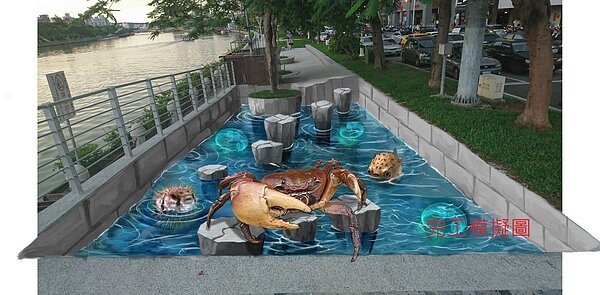 高雄市政府明天起將在五福路與河東路口進行3D生態彩繪,規畫3D彩繪,採用愛河原生物種為標的,包含兇狠圓軸蟹、海月水母、河豚等,設計跳石圖案可讓民眾和這些愛河住民們互動、打卡。圖/高雄市工務局提供