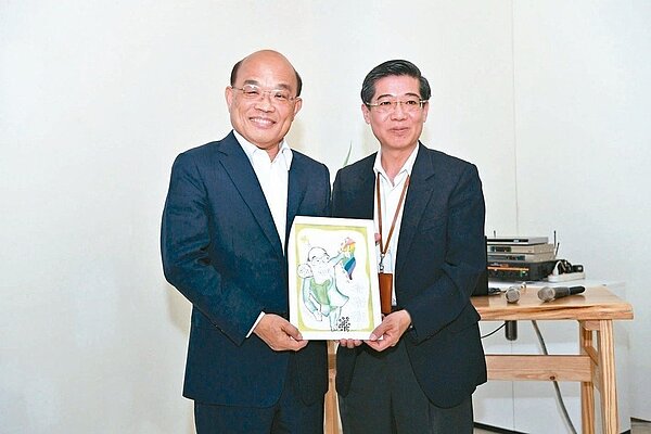 智邦董事長郭飛龍（右）贈送行政院長蘇貞昌肖像漫畫。 行政院／提供
