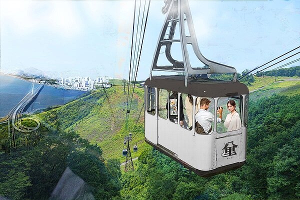 新北市政府觀光旅遊局舉辦八里纜車BOO公共建設招商案,不過土地取得、纜車路線、沿線墓地的處理等都待解決。圖/新北市政府