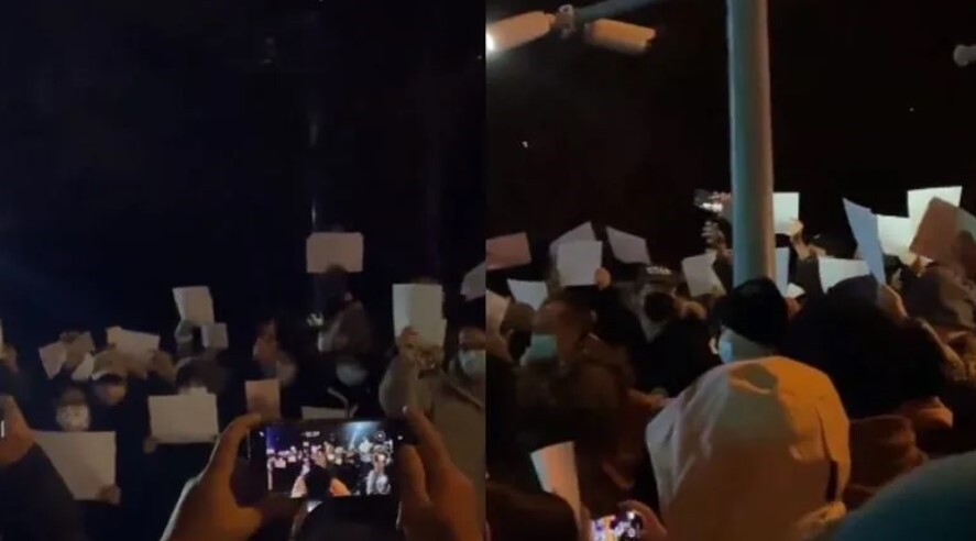 中國近日爆發白紙革命,中國各地人民走上街頭「高舉白紙」,高唱國際歌。圖/翻攝自推特