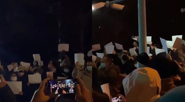 中國近日爆發白紙革命,中國各地人民走上街頭「高舉白紙」,高唱國際歌。圖/翻攝自推特