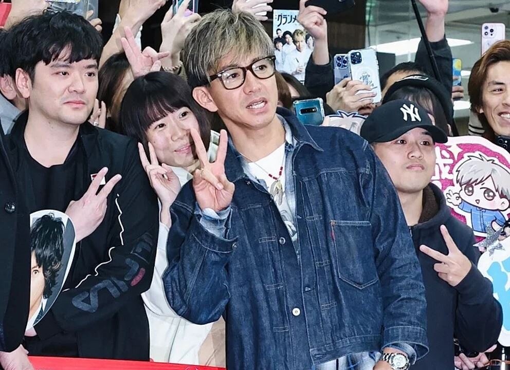 木村拓哉日前旋風訪台,現身松山機場和粉絲合照。記者王聰賢/攝影