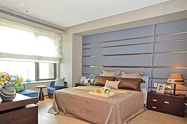 臥室採光通透，木系設計讓家有更溫暖的感覺。